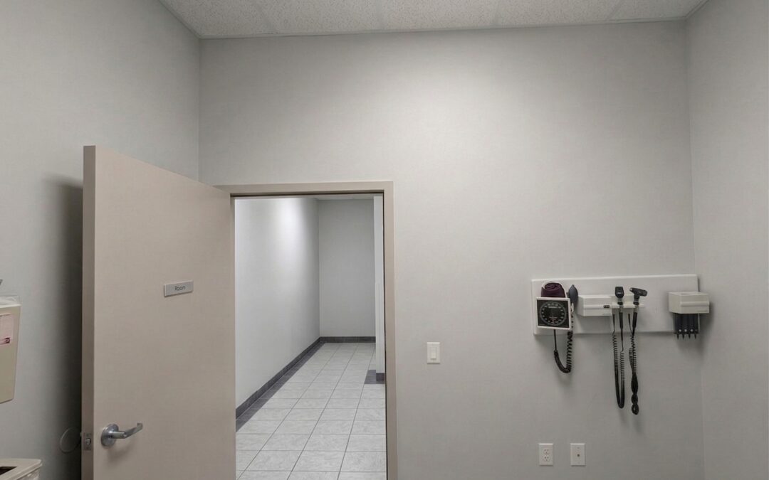 Freshly painted Toronto medical clinic wall after dense-fill acoustic retrofit