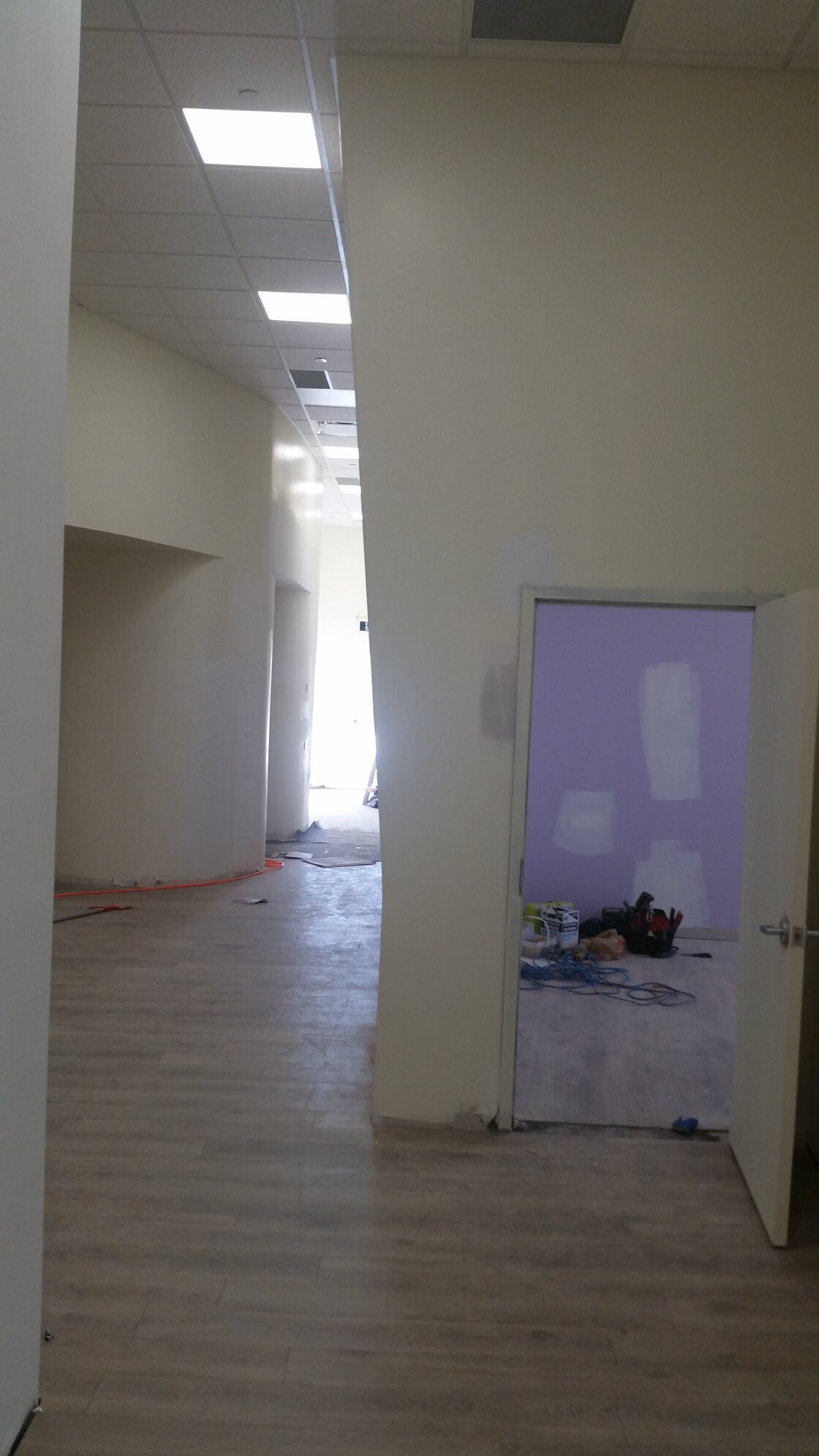 Daycare corridor angled partitions and curved wall forms RCATSone window mullion sound barrier installation